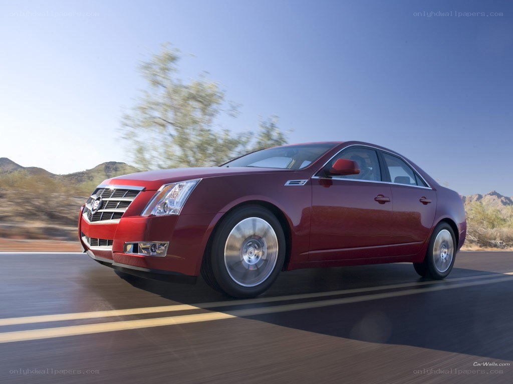 Red Cadillac CTS in motion