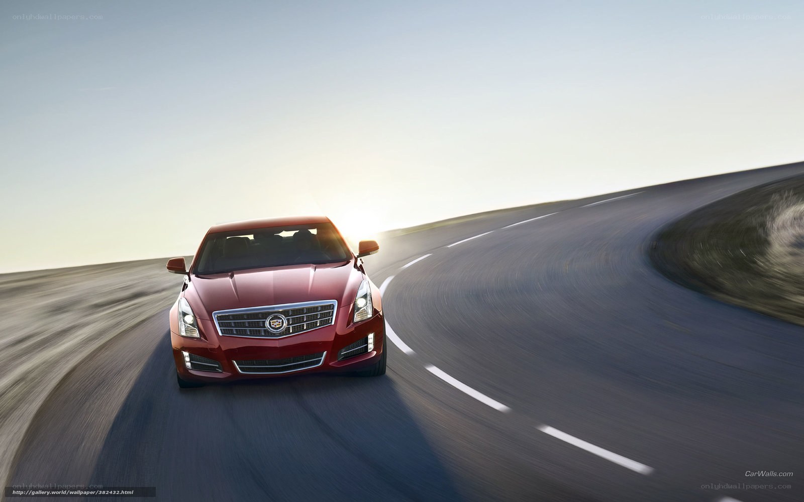 Red Cadillac on a winding road