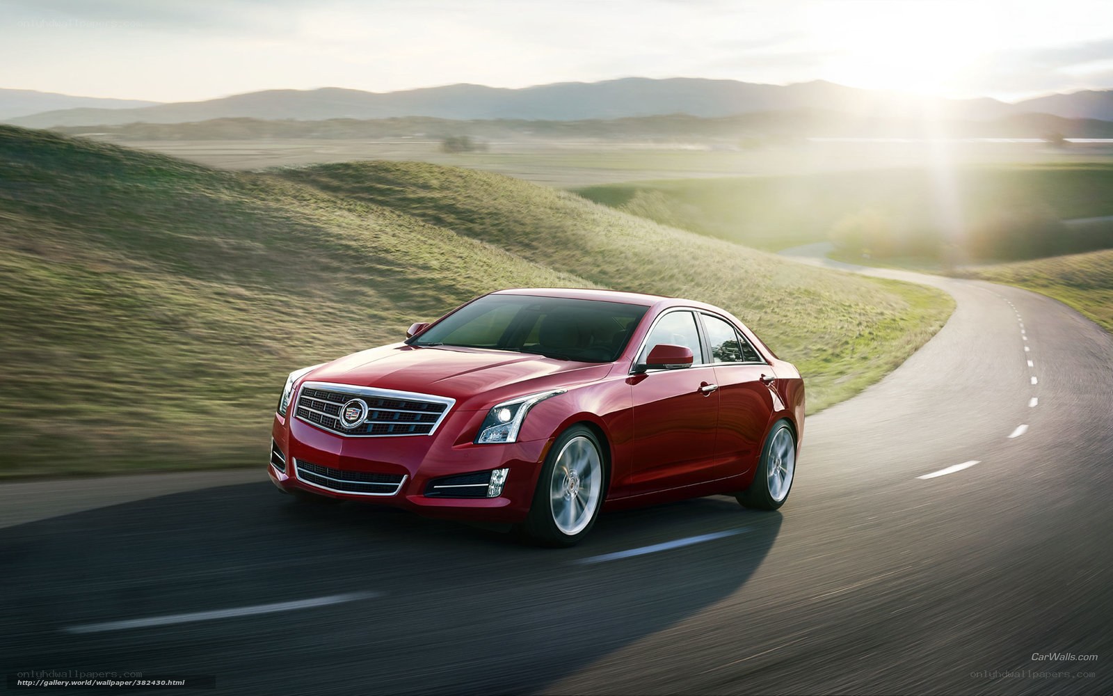 Red Cadillac on a winding road