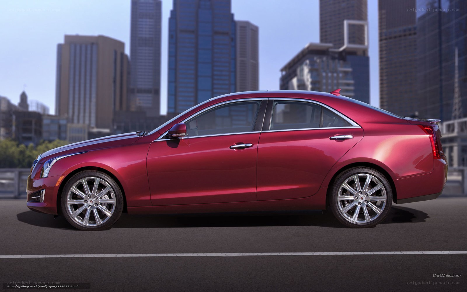 red cadillac sedan in city