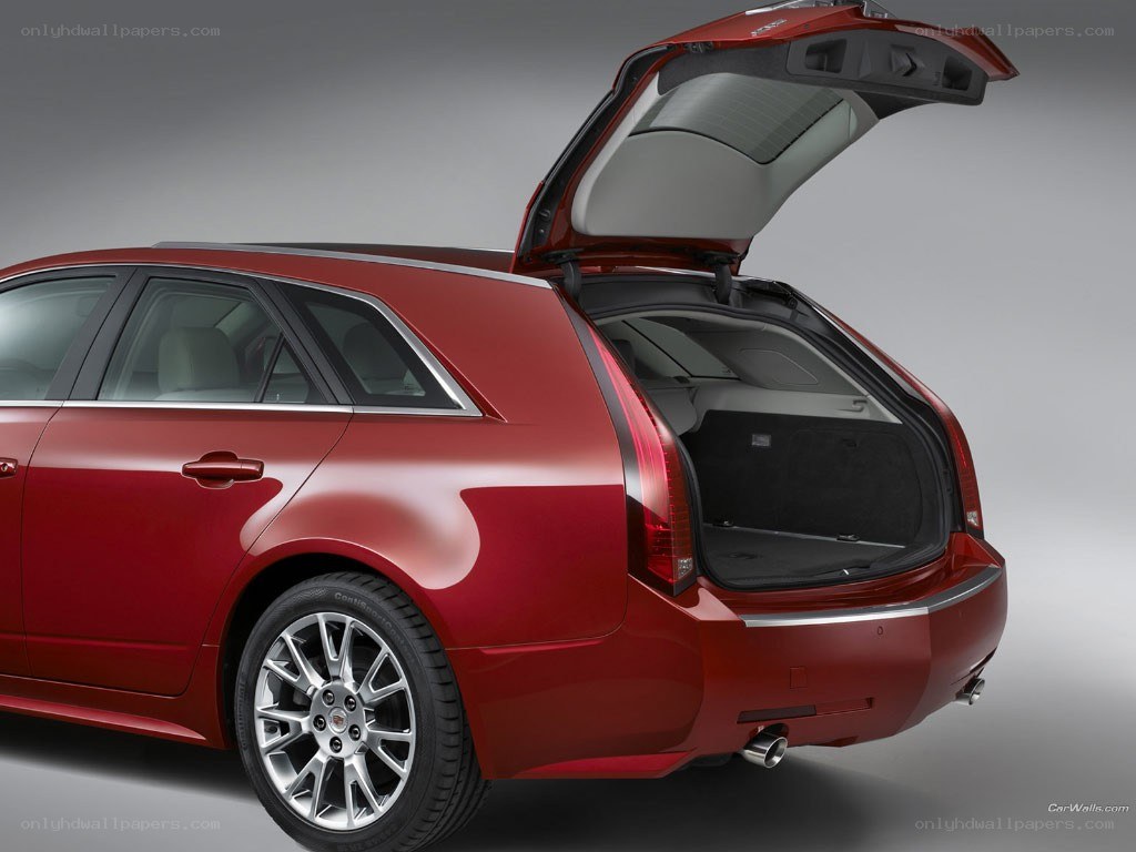 red cadillac wagon with open trunk
