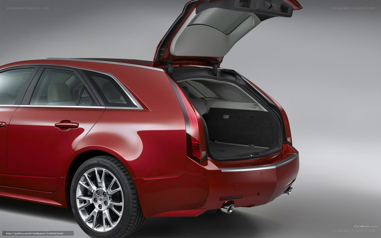Red Cadillac wagon with open trunk