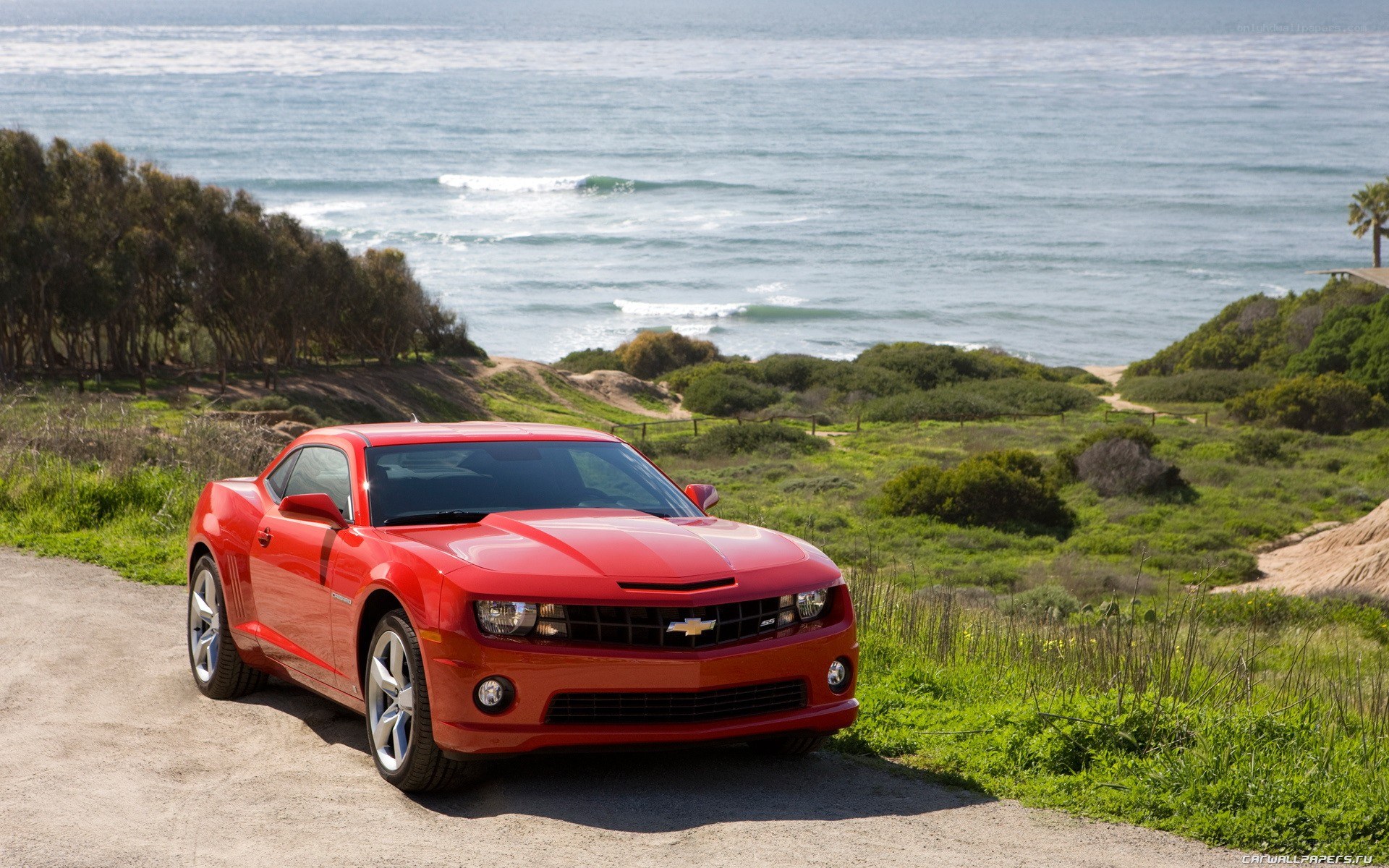 Red Camaro by the ocean