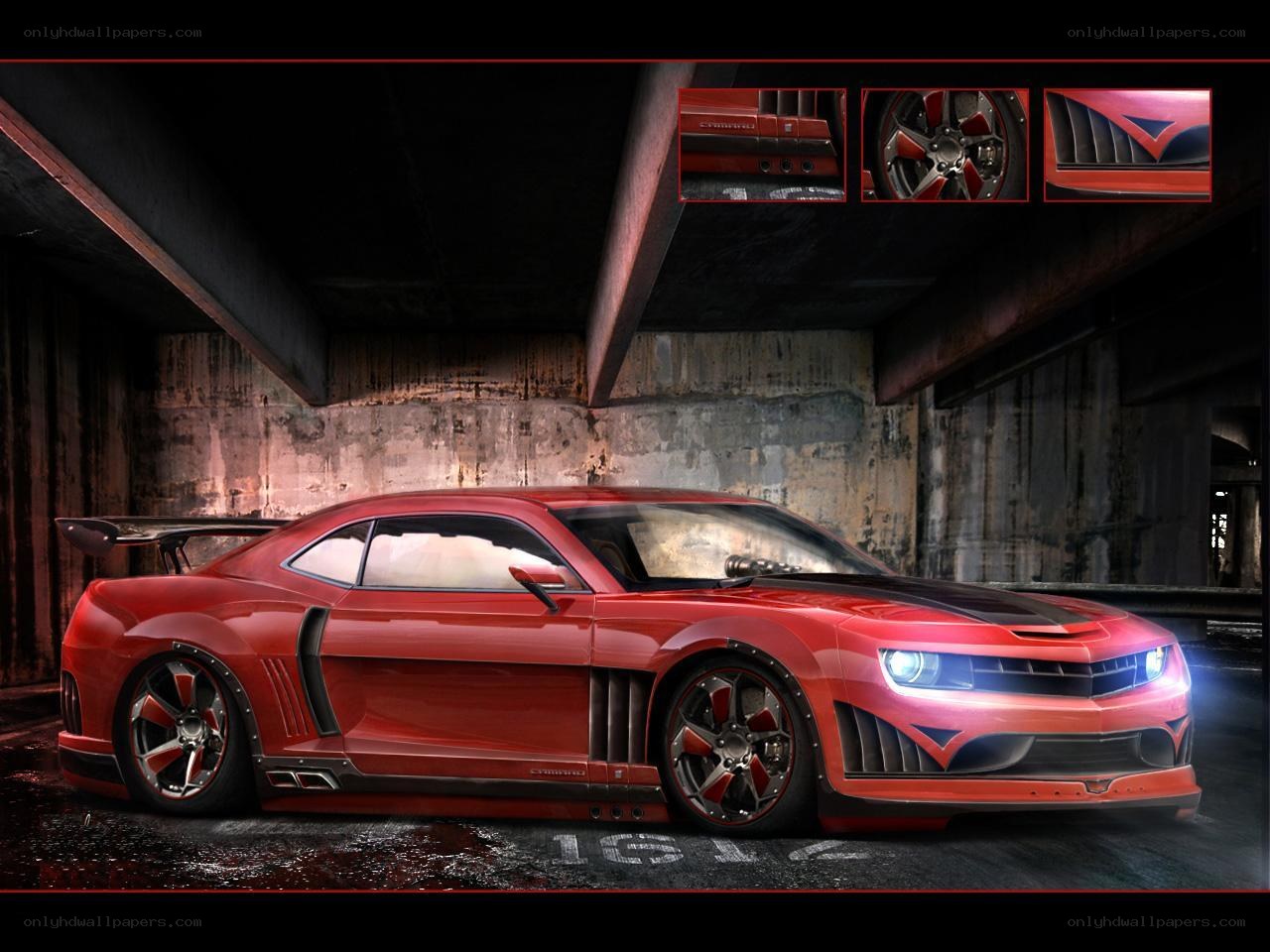 Red Camaro in a garage