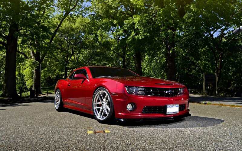 Red Camaro in a park