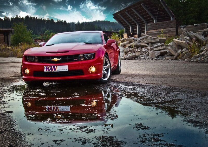 Red Camaro in a puddle