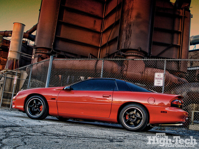 Red Camaro in industrial setting