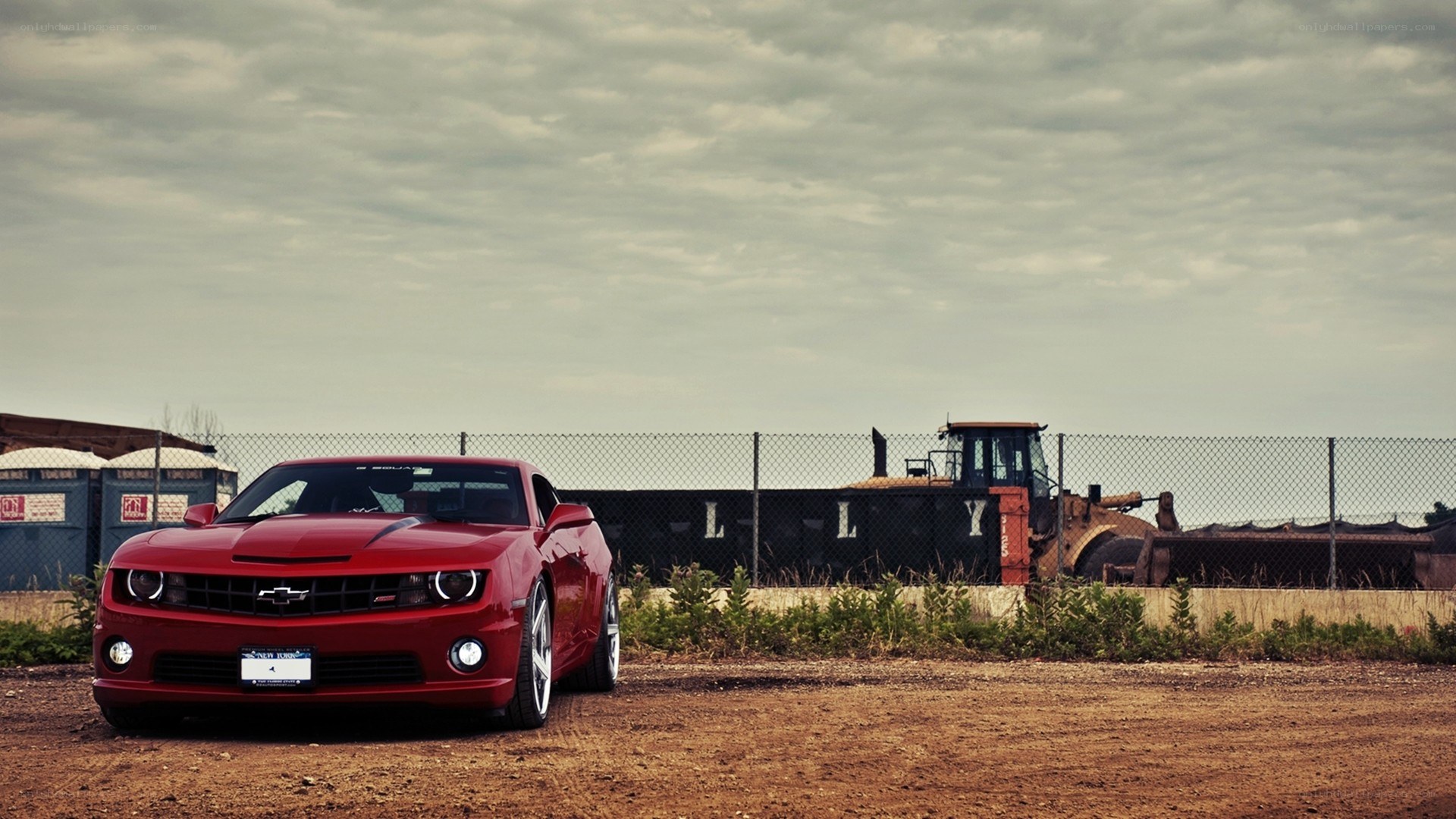 Red Camaro in industrial setting