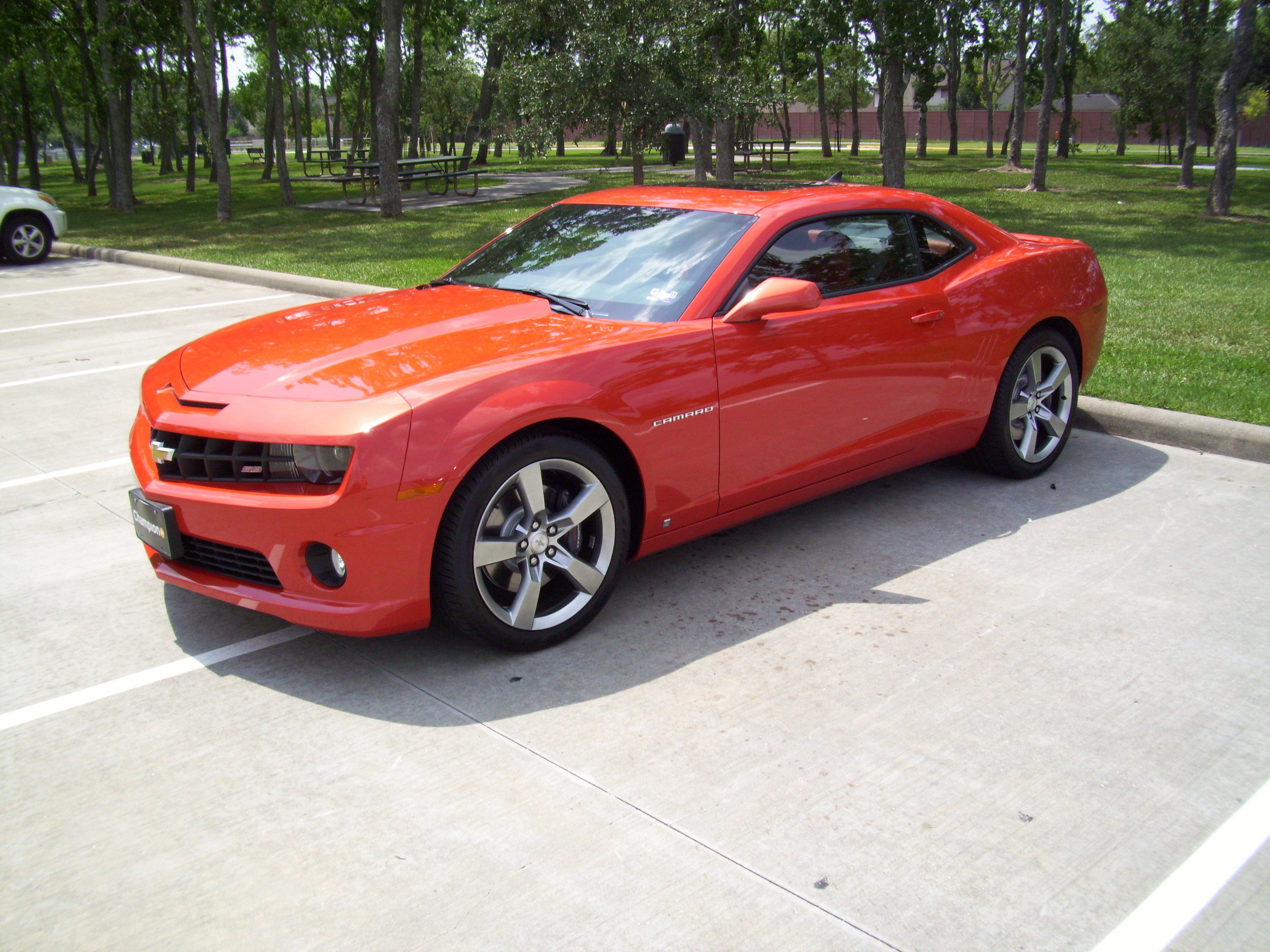Red Camaro in parking lot