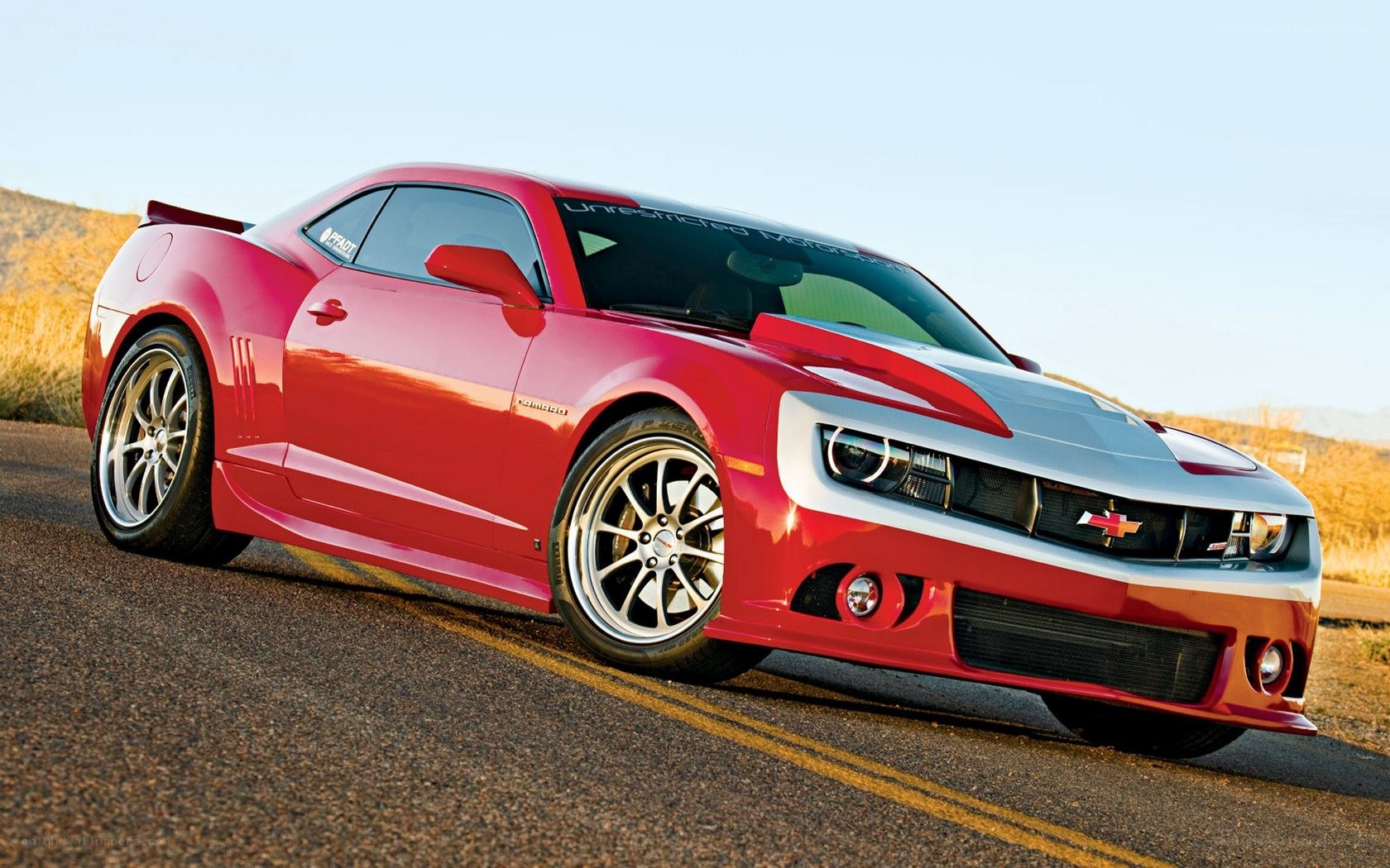Red Camaro on a road