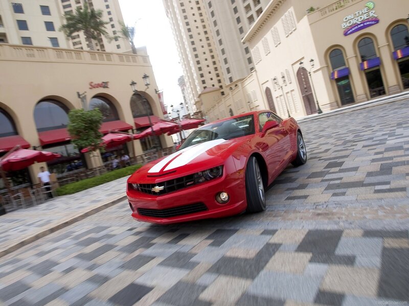 Red Camaro on city street