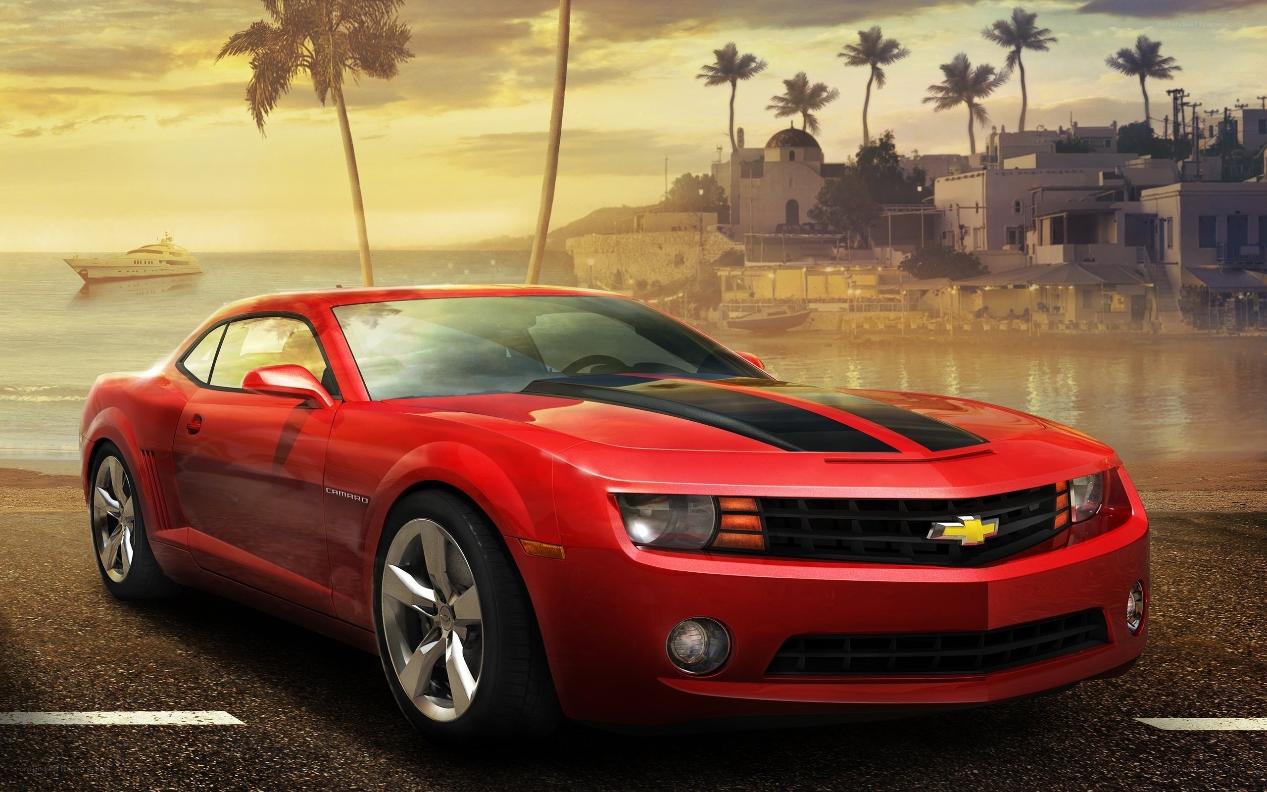 Red Camaro on coastal road