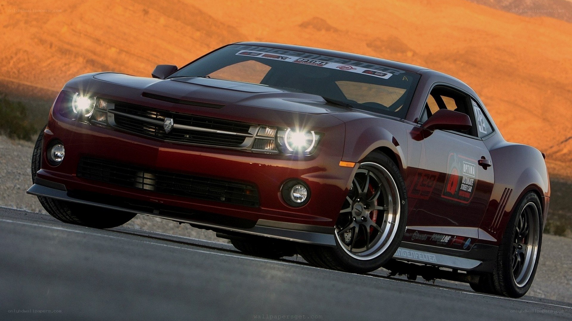 red camaro on desert road