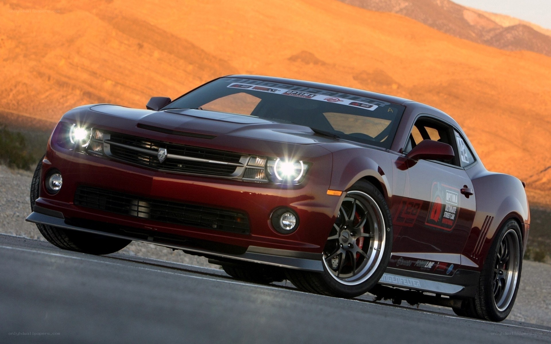 red camaro on desert road