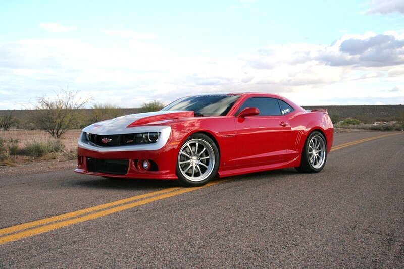 Red Camaro on desert road