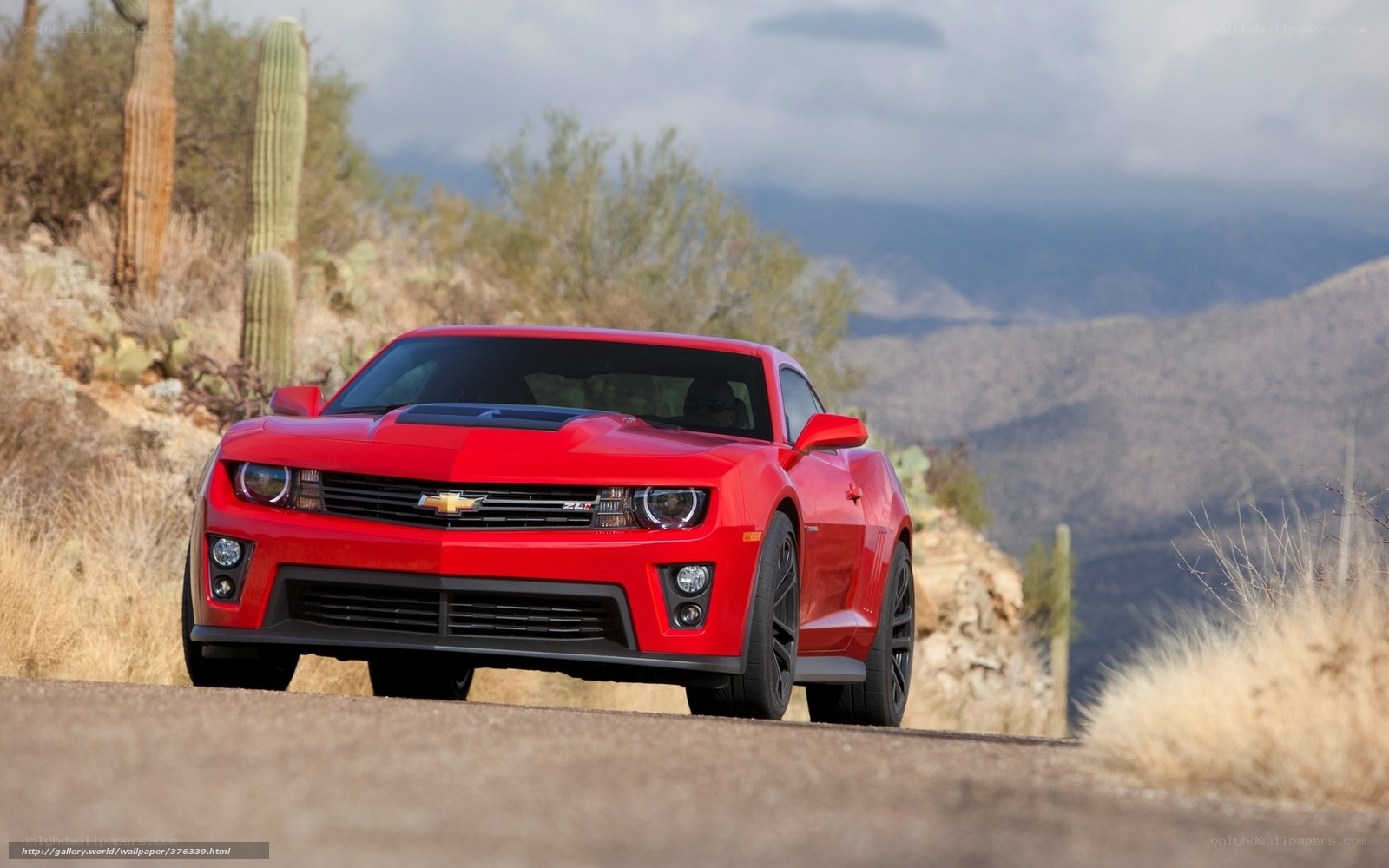 Red Camaro on desert road