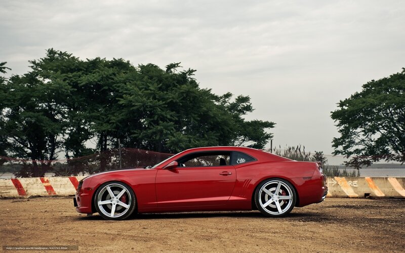 Red Camaro on dirt track