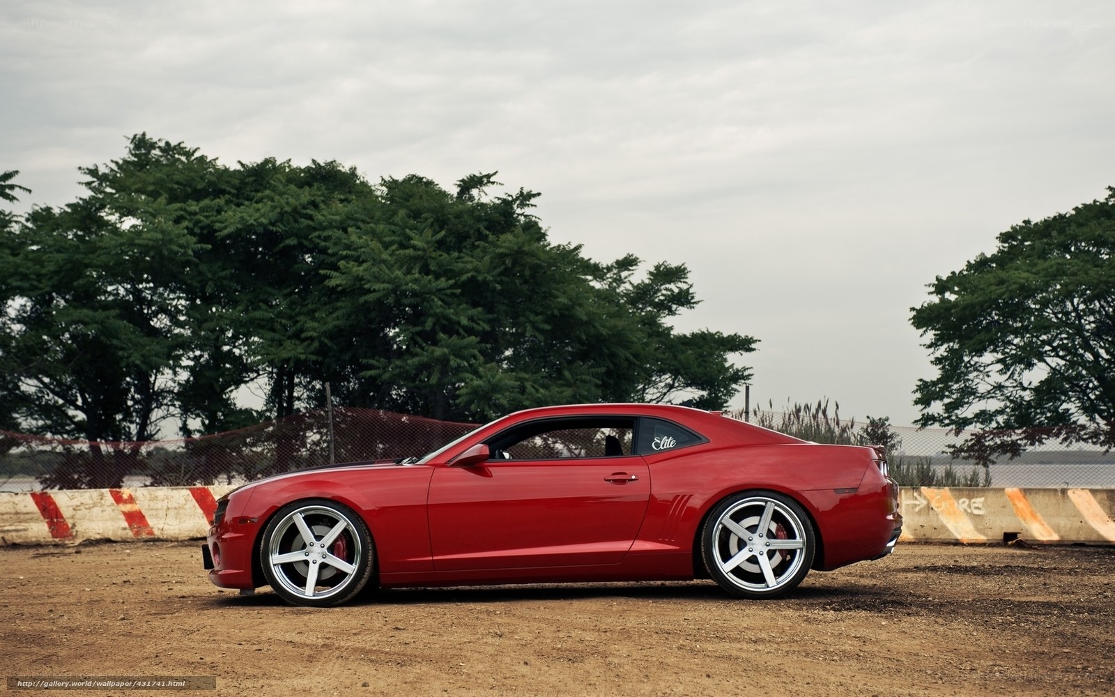 Red Camaro on dirt track