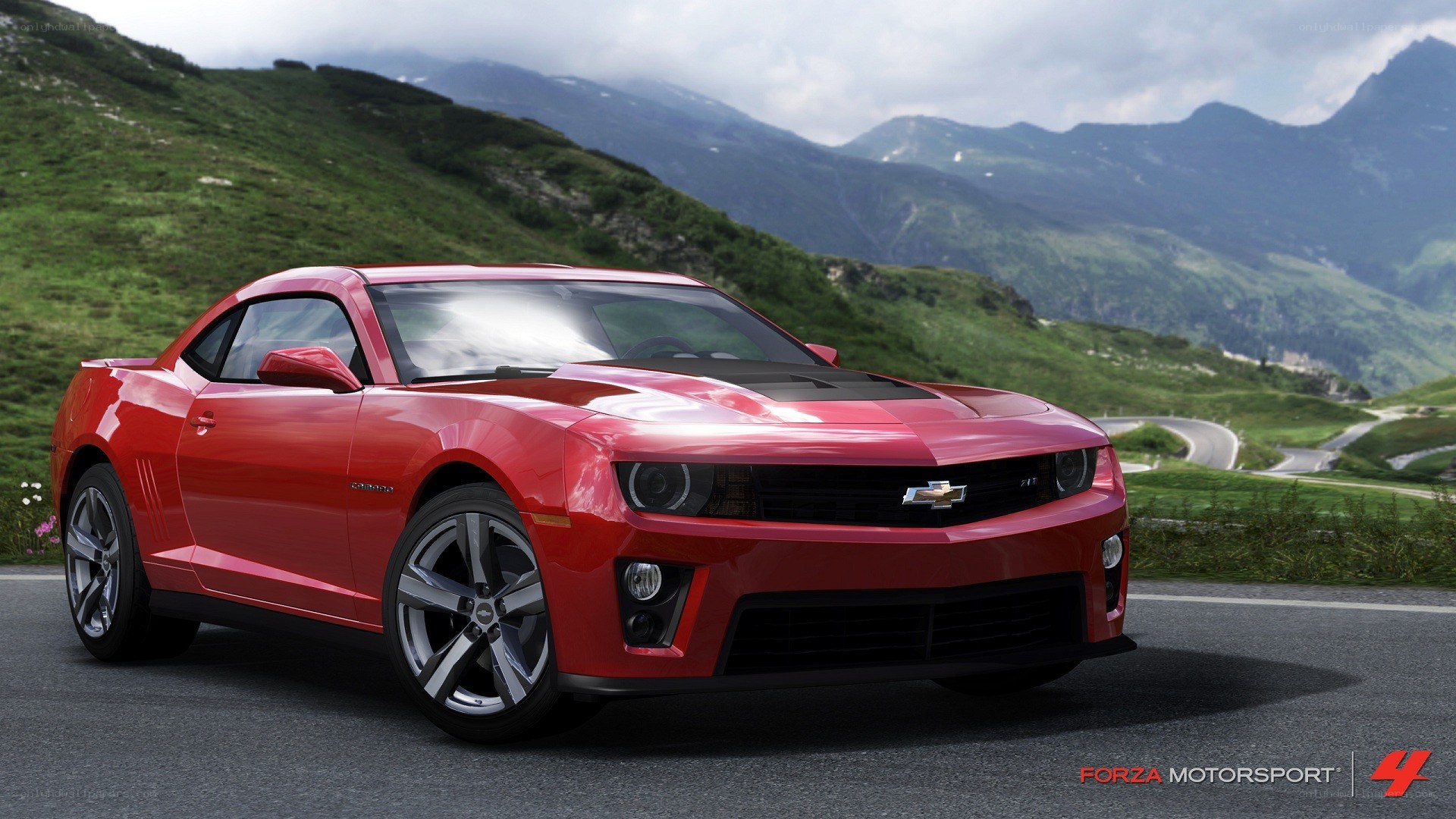 Red Camaro on mountain road