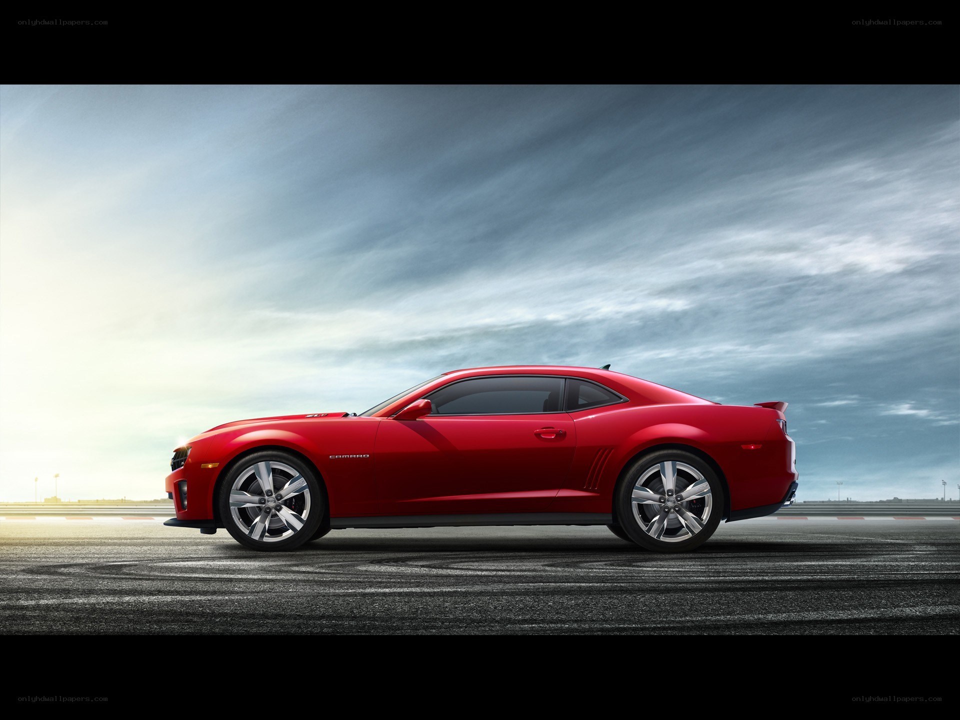 Red Camaro on racetrack