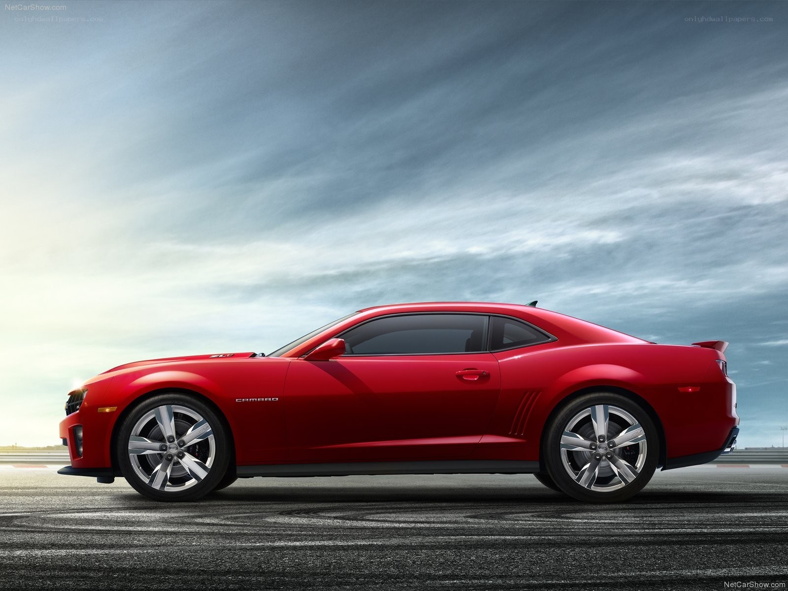 Red Camaro on racetrack