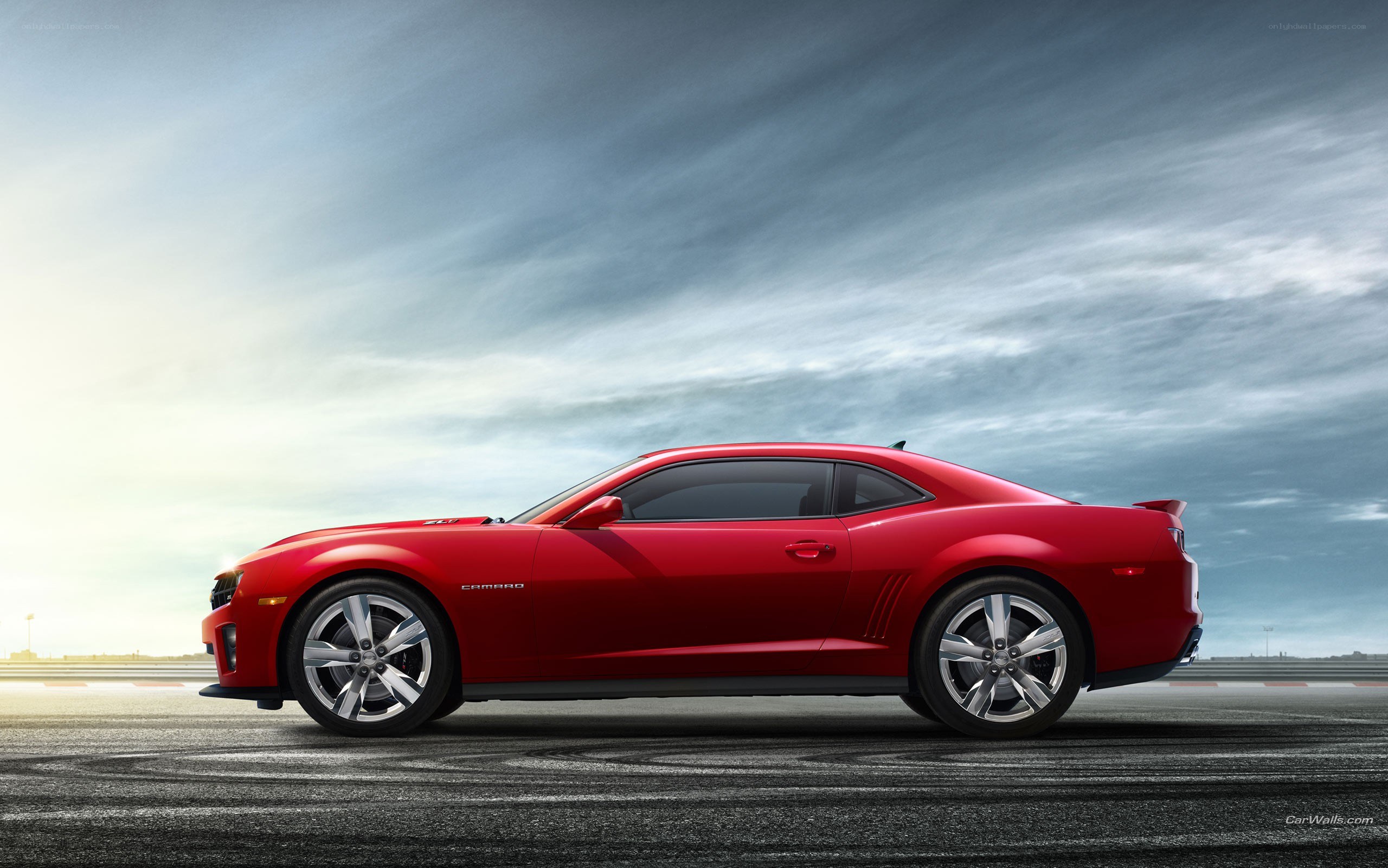 Red Camaro on racetrack