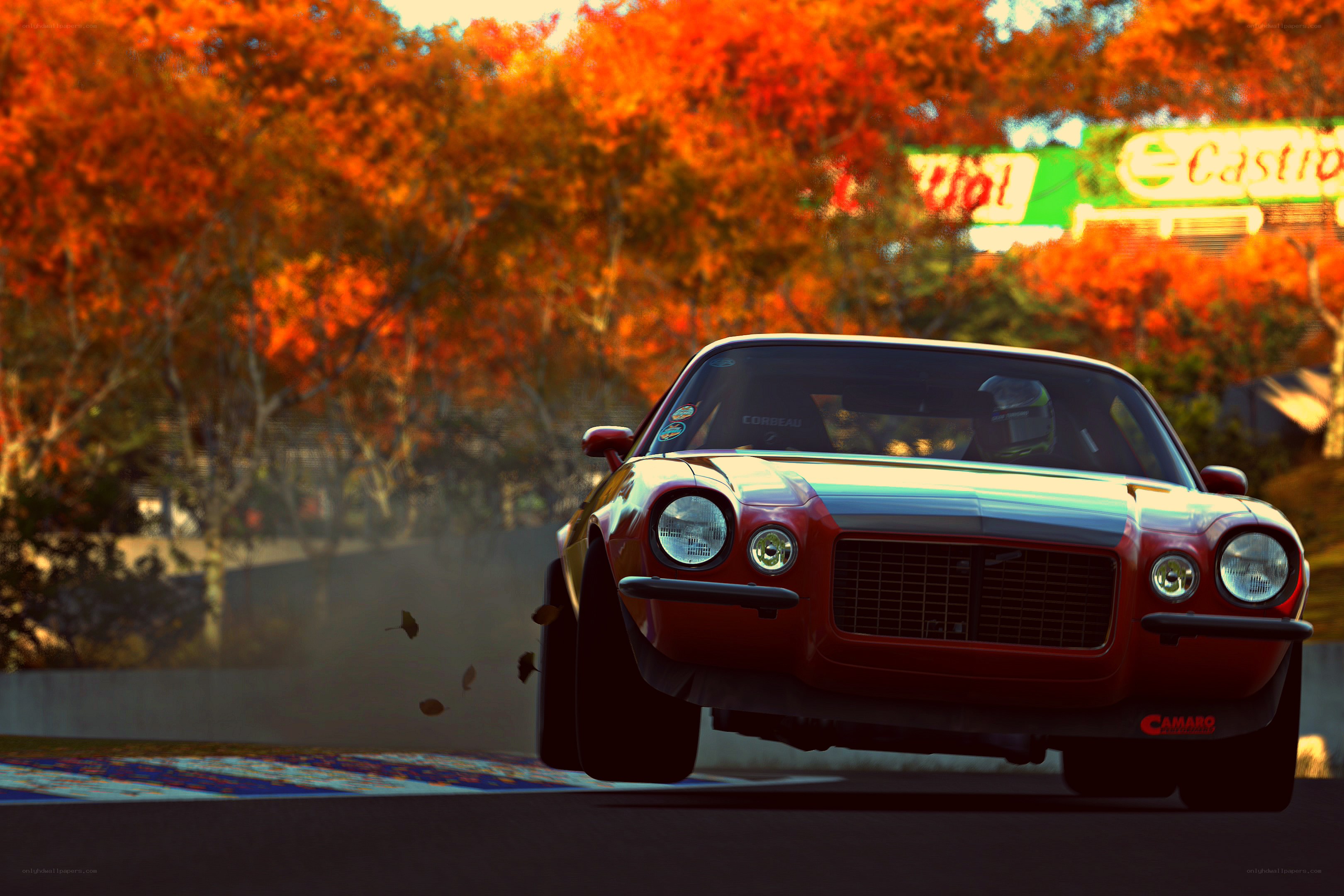 Red Camaro racing on track