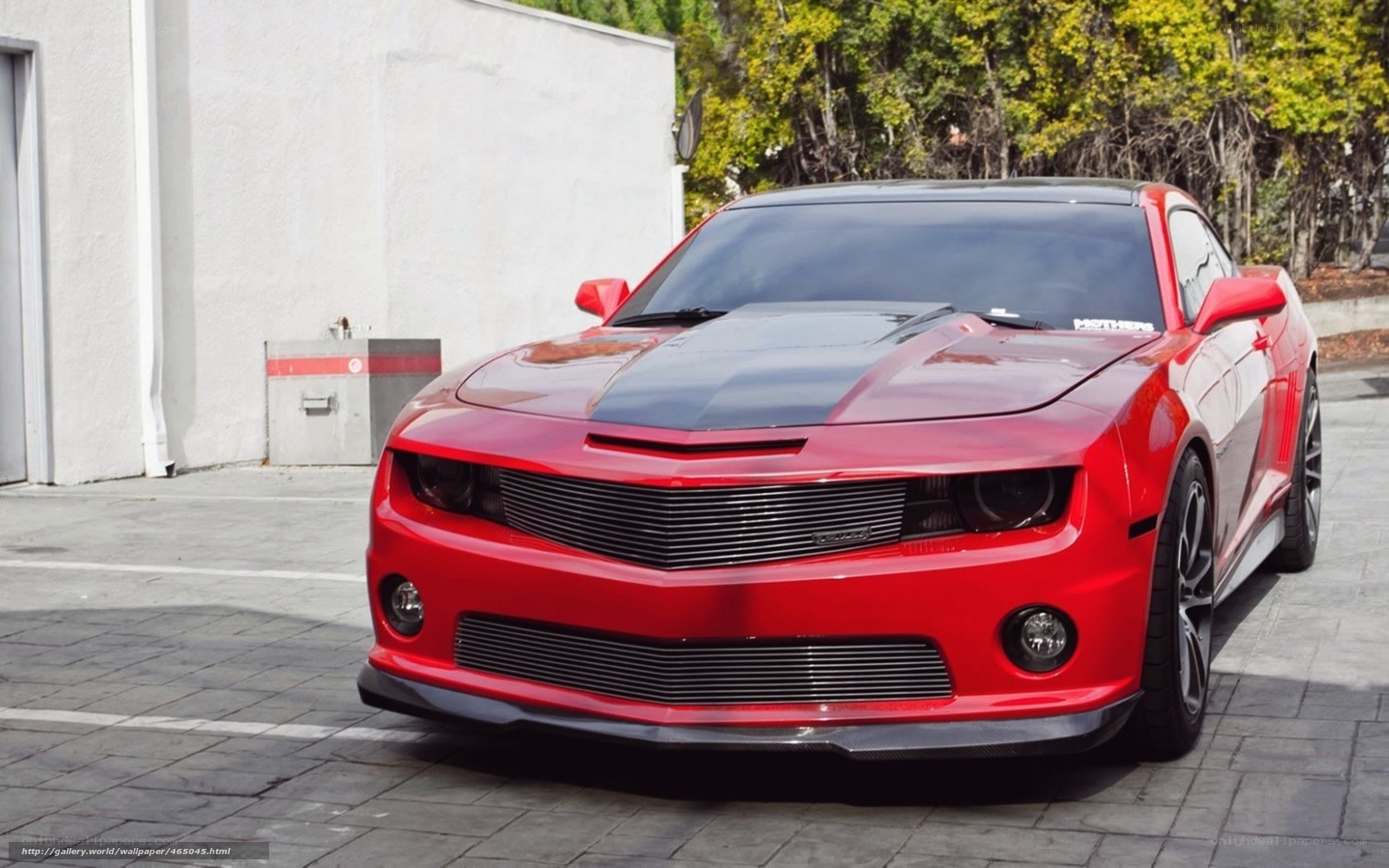 Red Camaro with black stripes