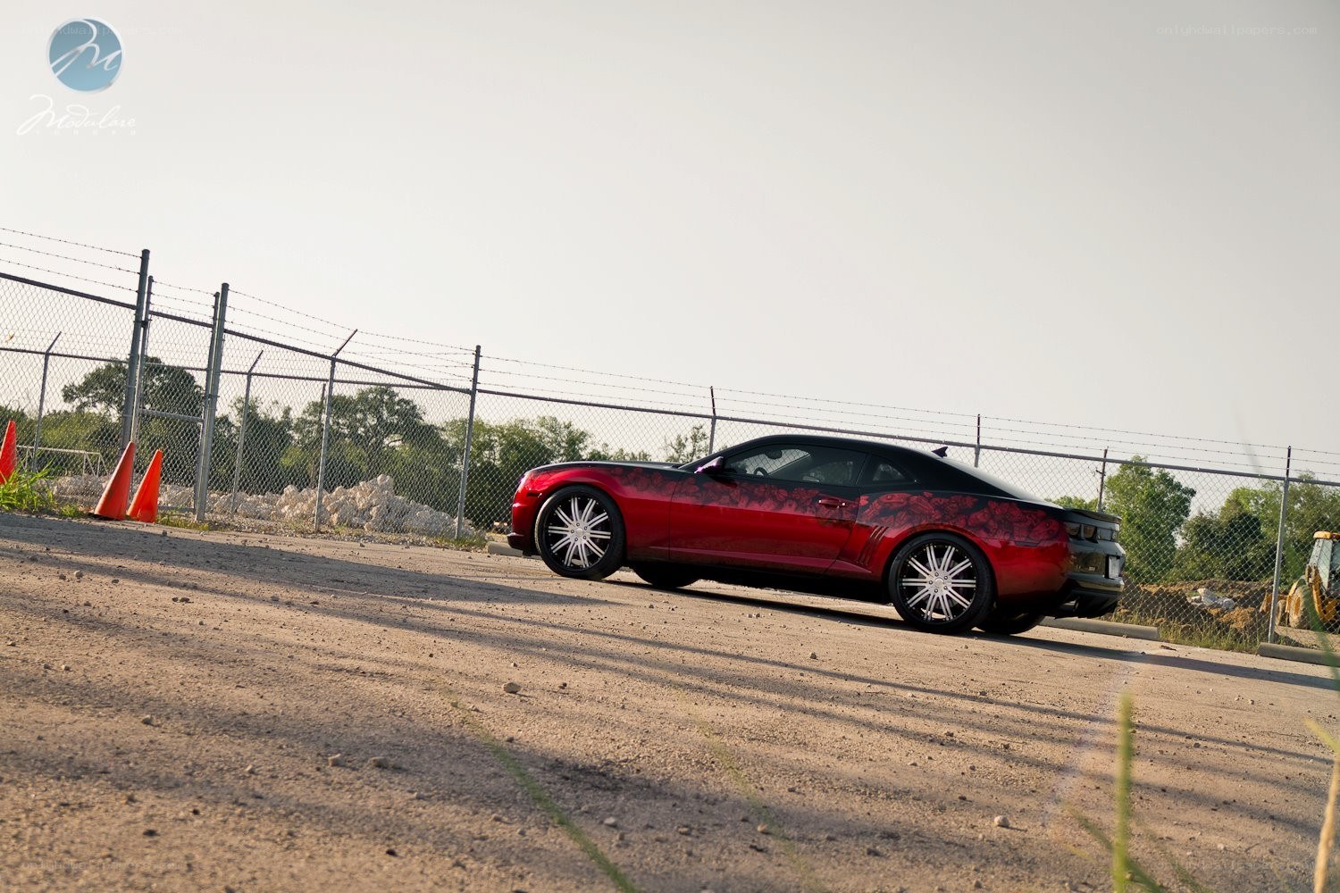 red camaro with custom wheels