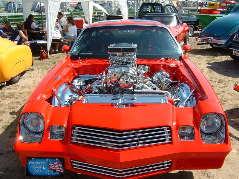 Red Camaro with engine exposed