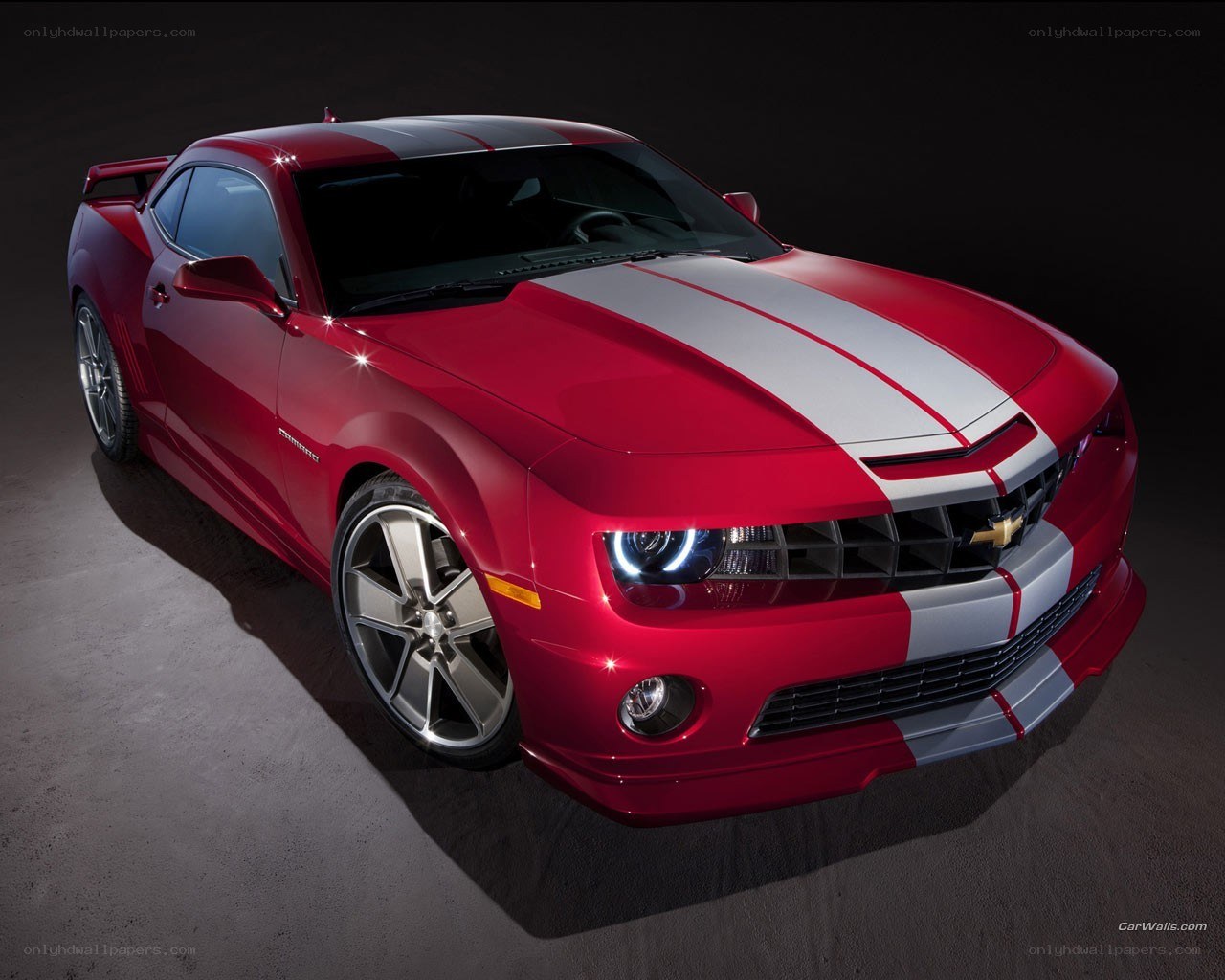 Red Camaro with racing stripes