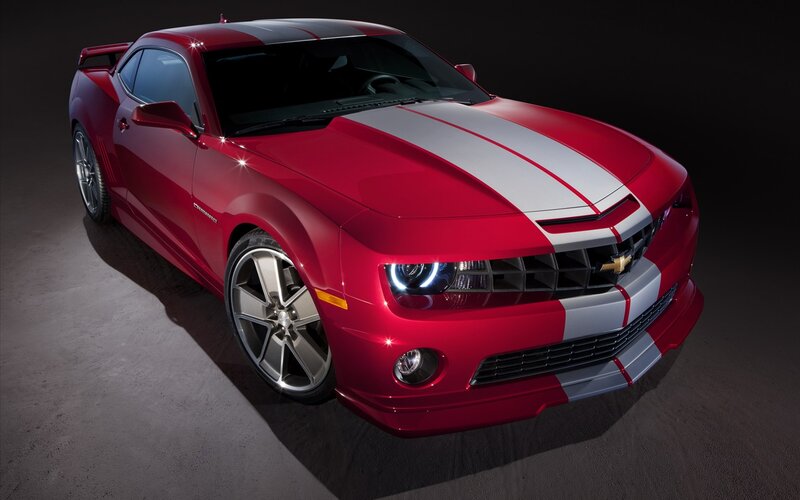 Red Camaro with racing stripes