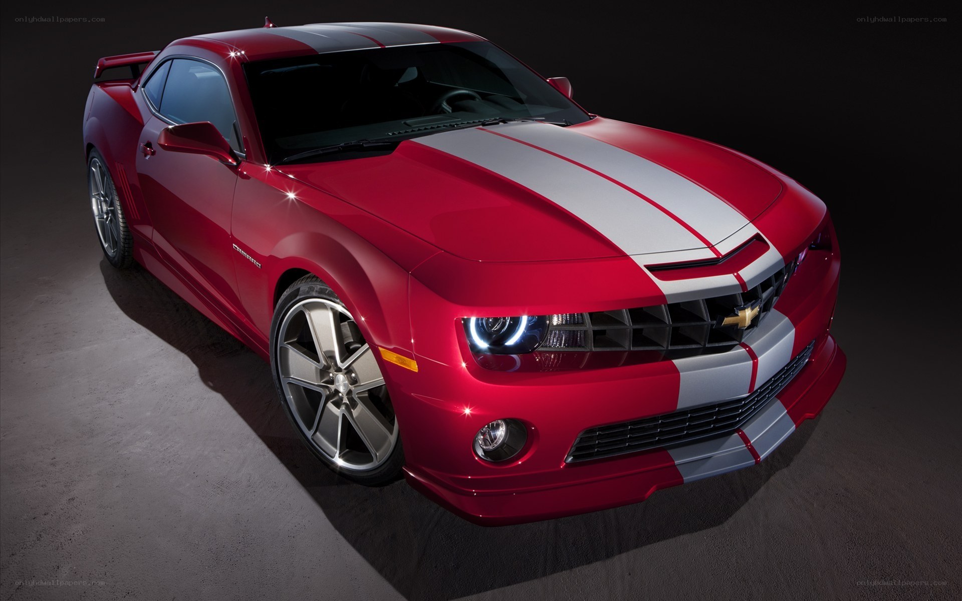 Red Camaro with racing stripes