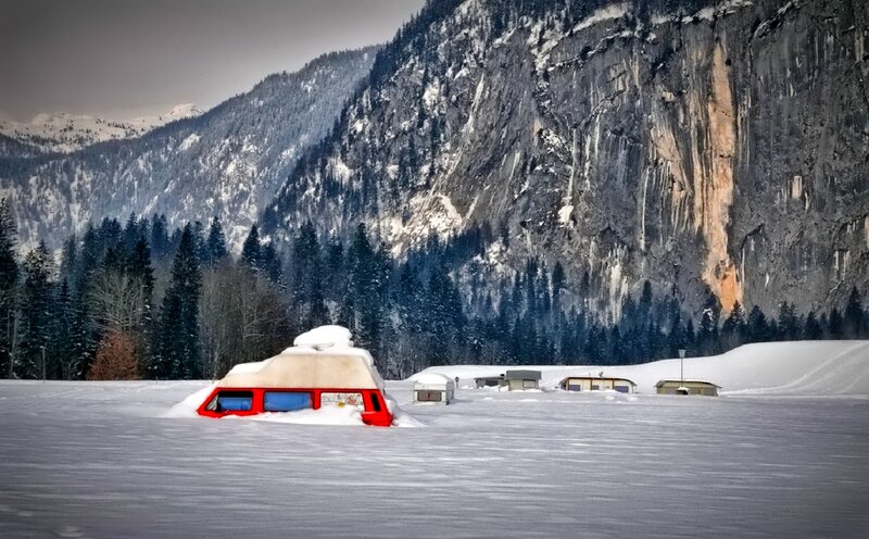 Red Camper Van in Snow