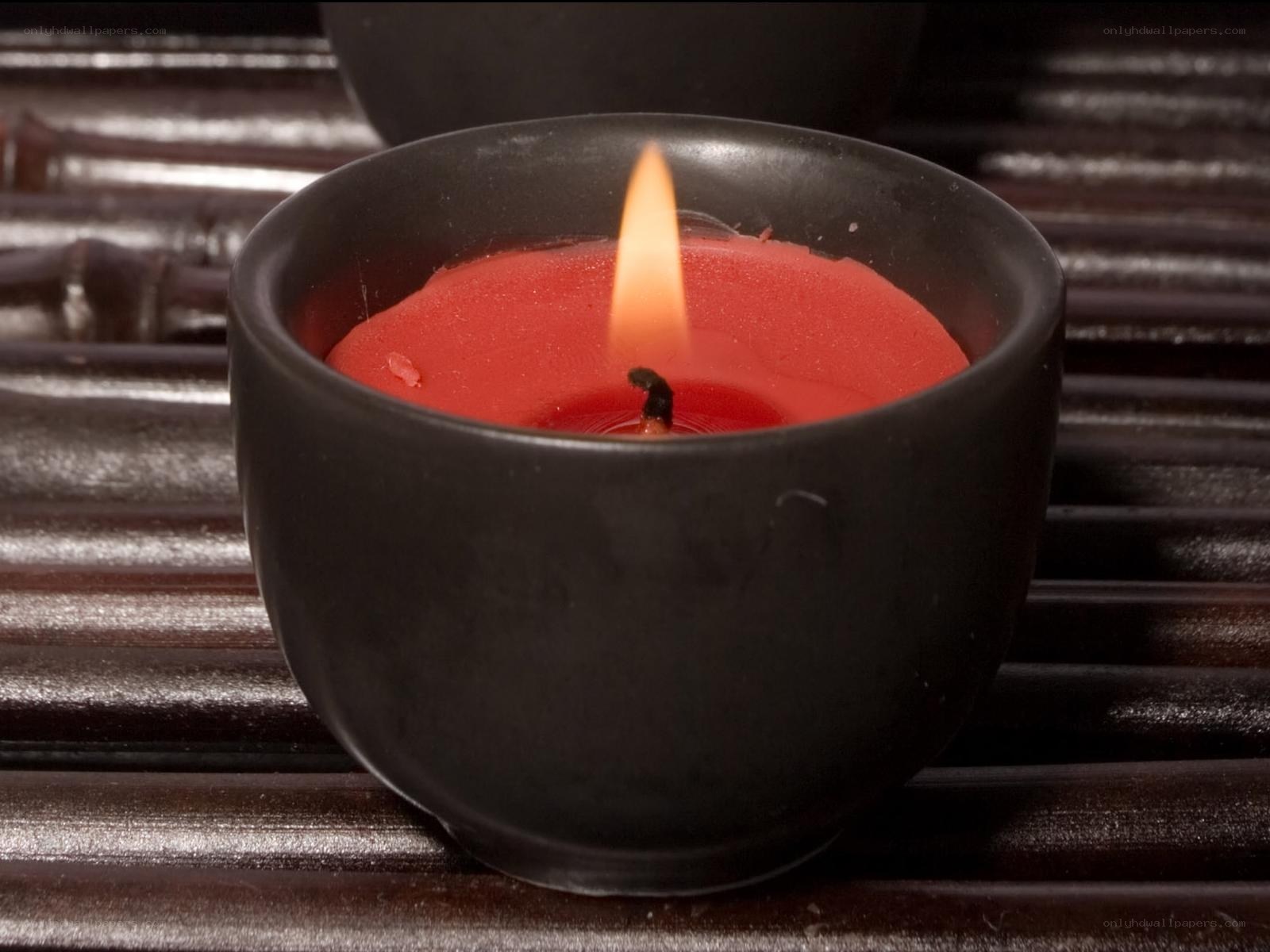 Red candle in black holder