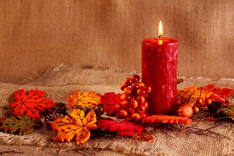 Red Candle with Autumn Leaves — Cozy