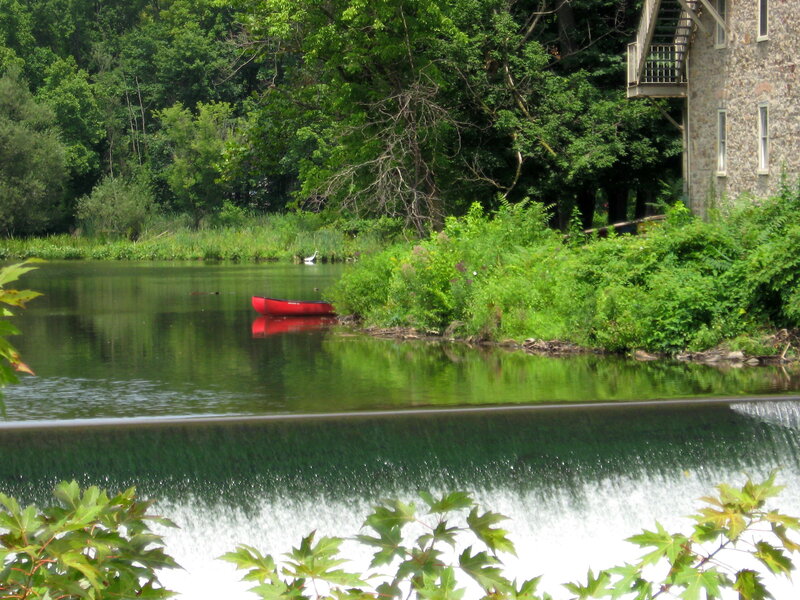 Red canoe on a calm river
