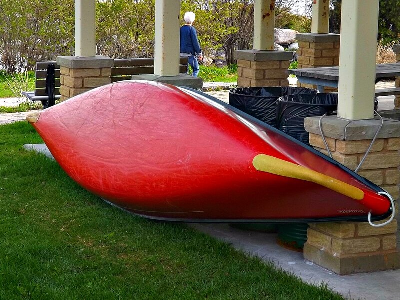 Red Canoe on Grass