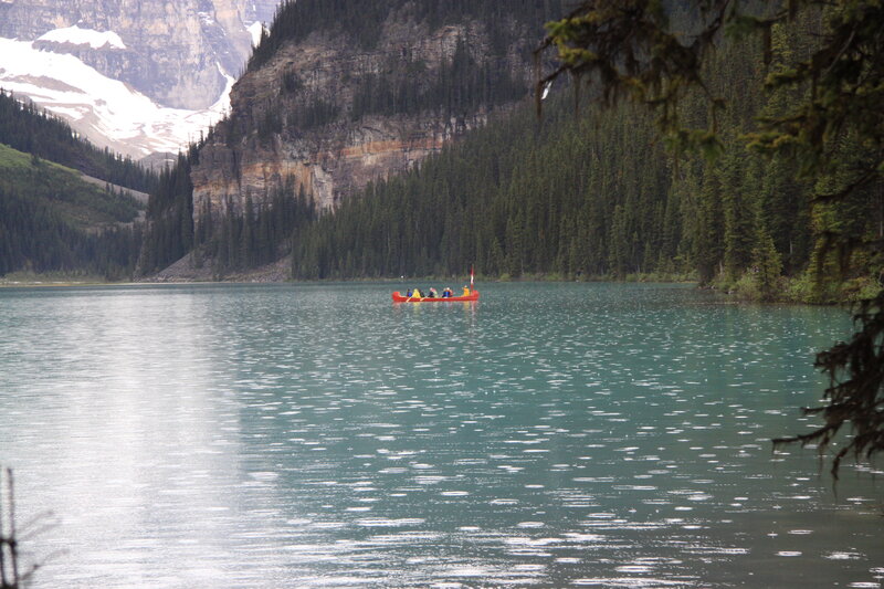 Red Canoe on Lake — Green, Serene, Afternoon