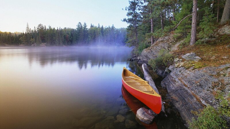 Red Canoe on Lake Shore
