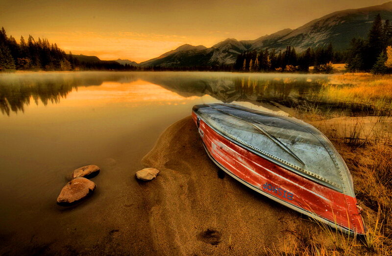 Red Canoe on Shore — Orange