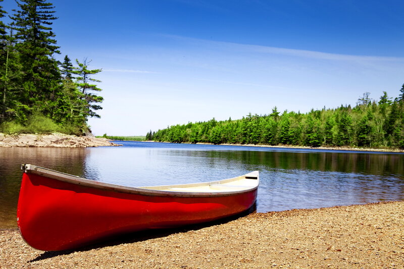 Red Canoe on Shore — Serene