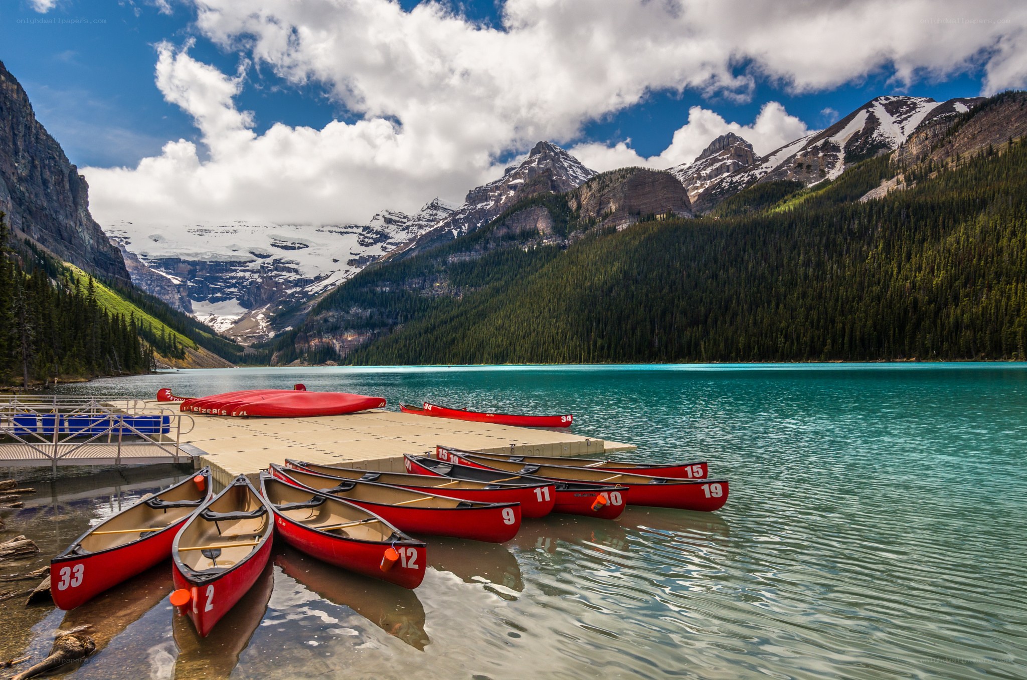 Red canoes at a mountain lake