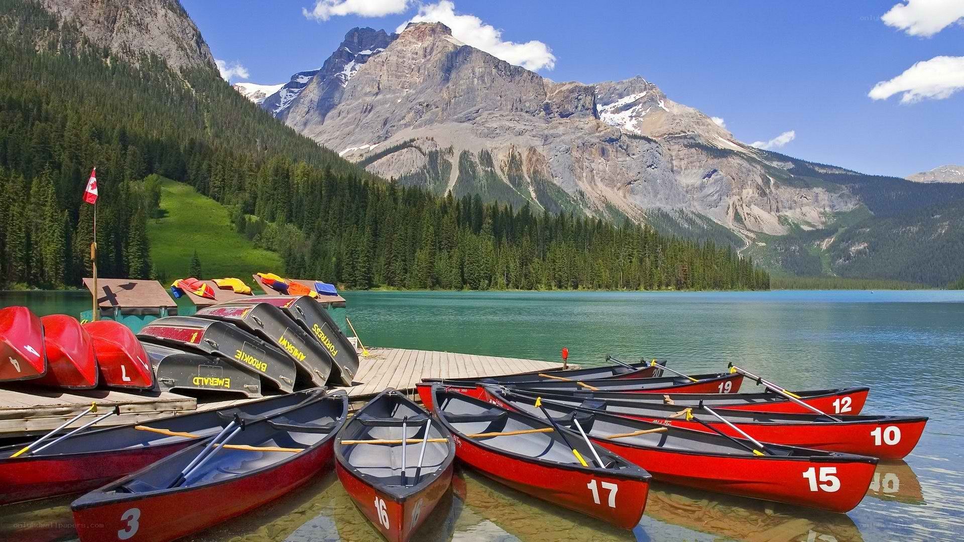Red canoes at a mountain lake