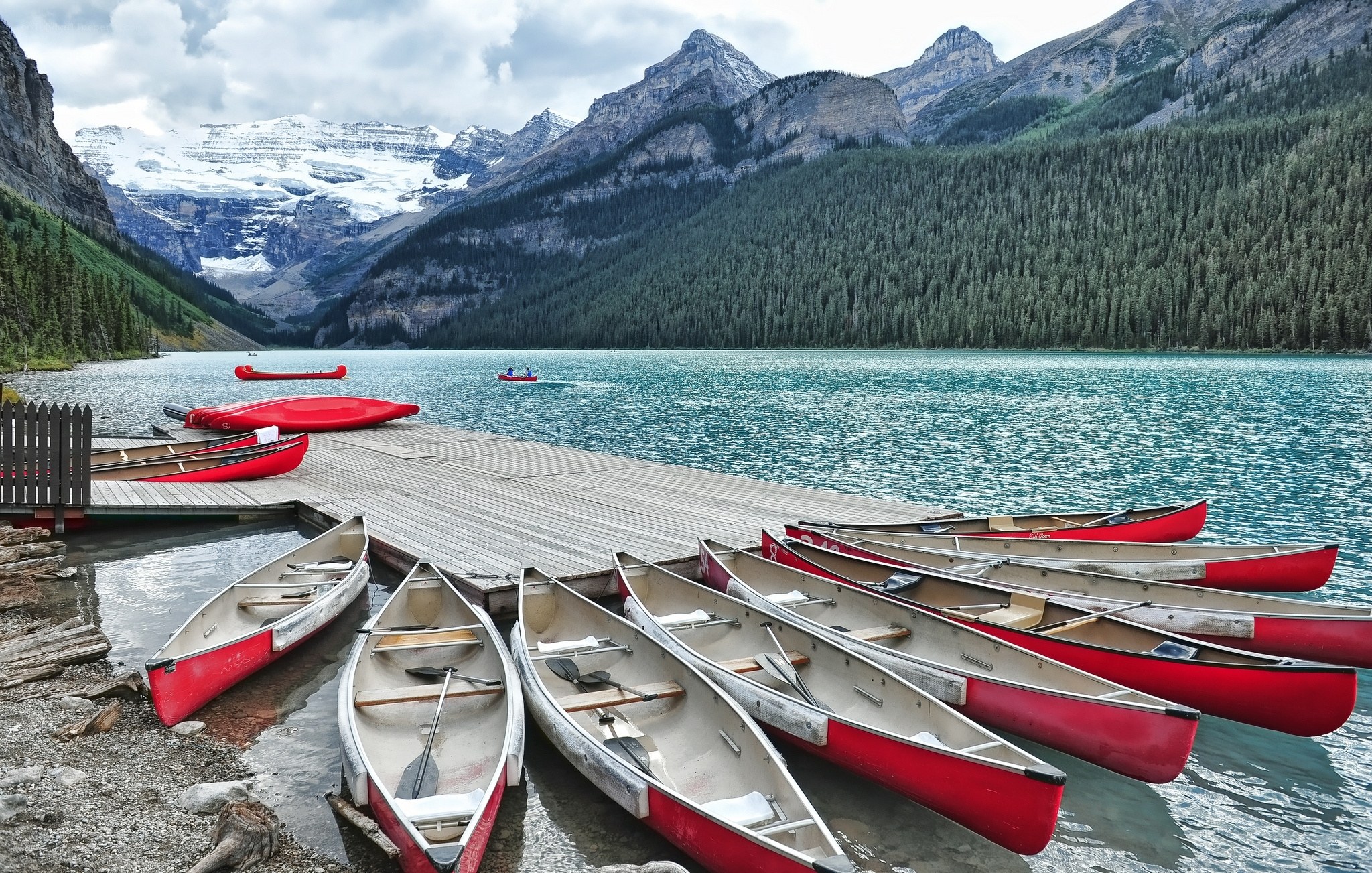 Red canoes at a mountain lake