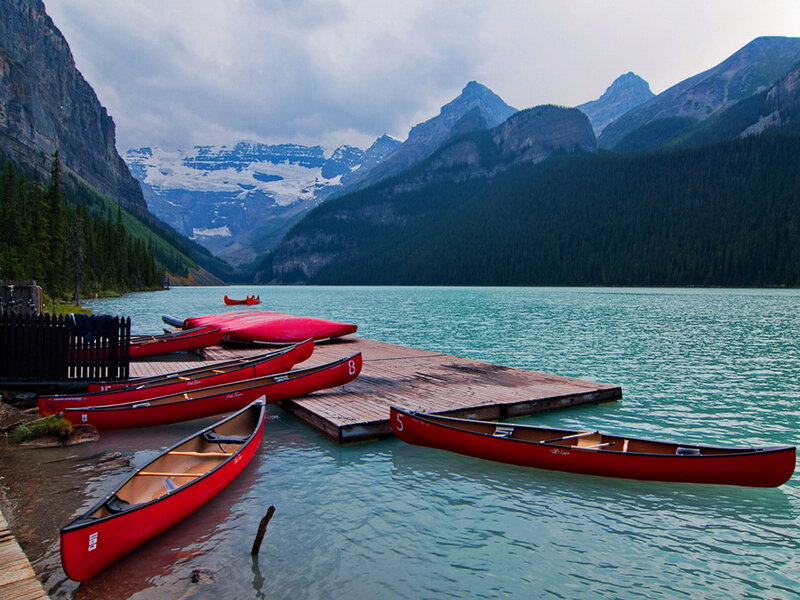 Red Canoes on Lake — Serene