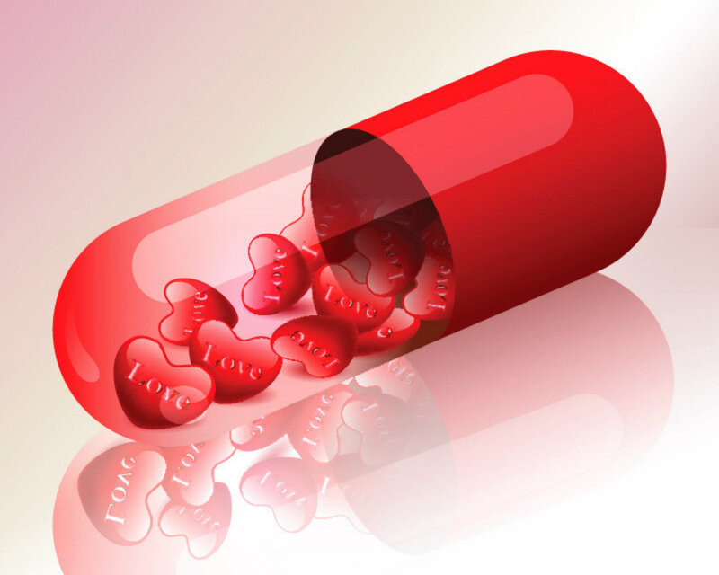 Red Capsule with Heart Pills