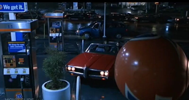 Red Car at Gas Station — Dramatic