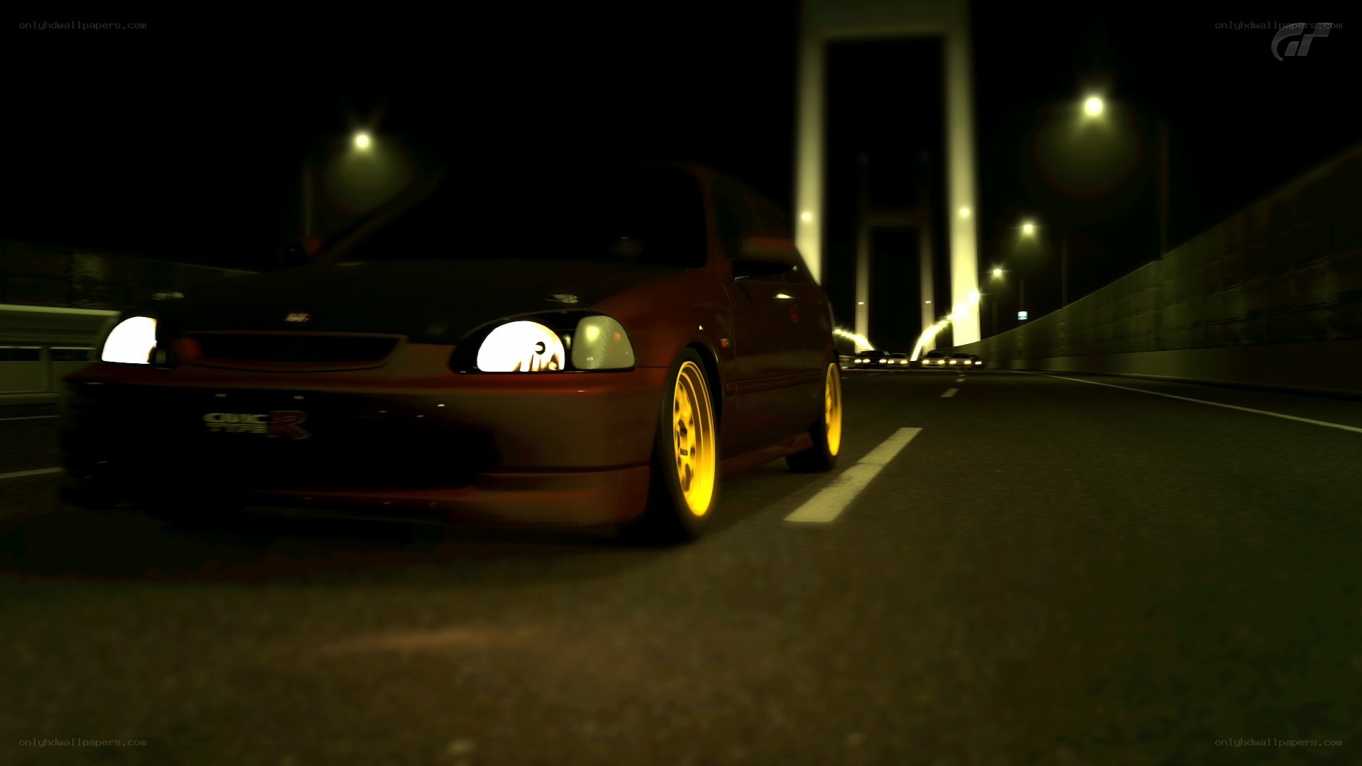 red car at night on bridge