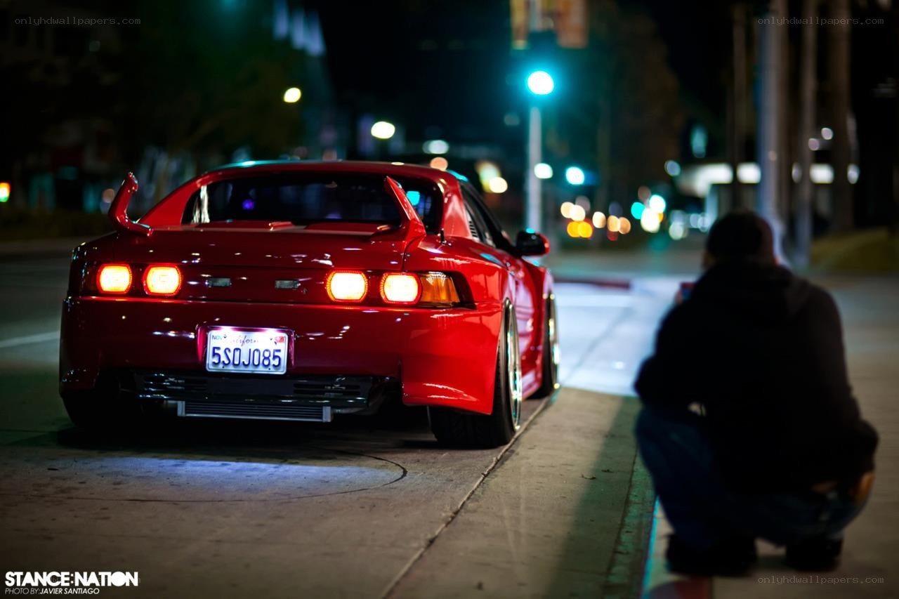 Red car at night on street